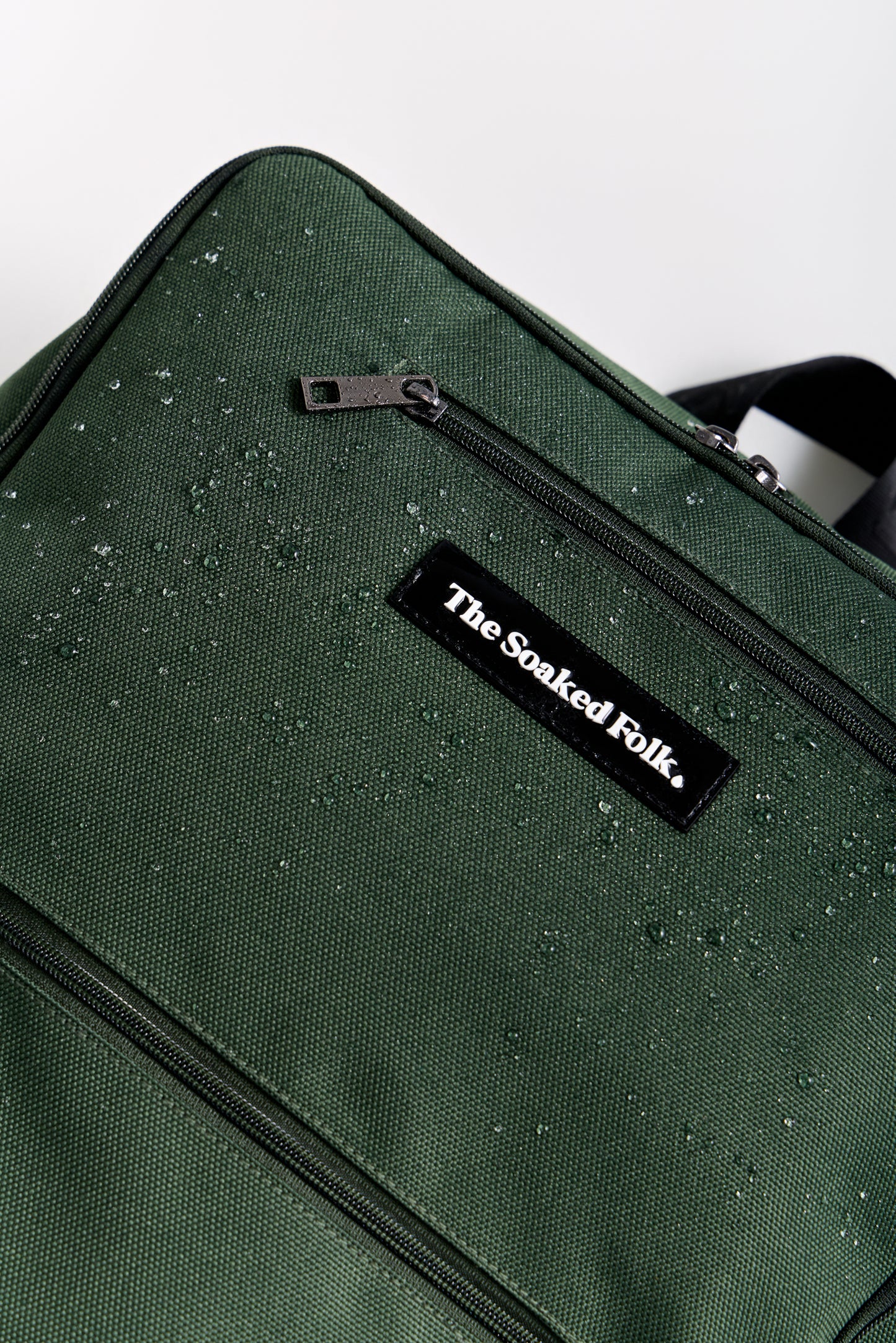 Green bag with 'The Soaked Folk' label on a white background