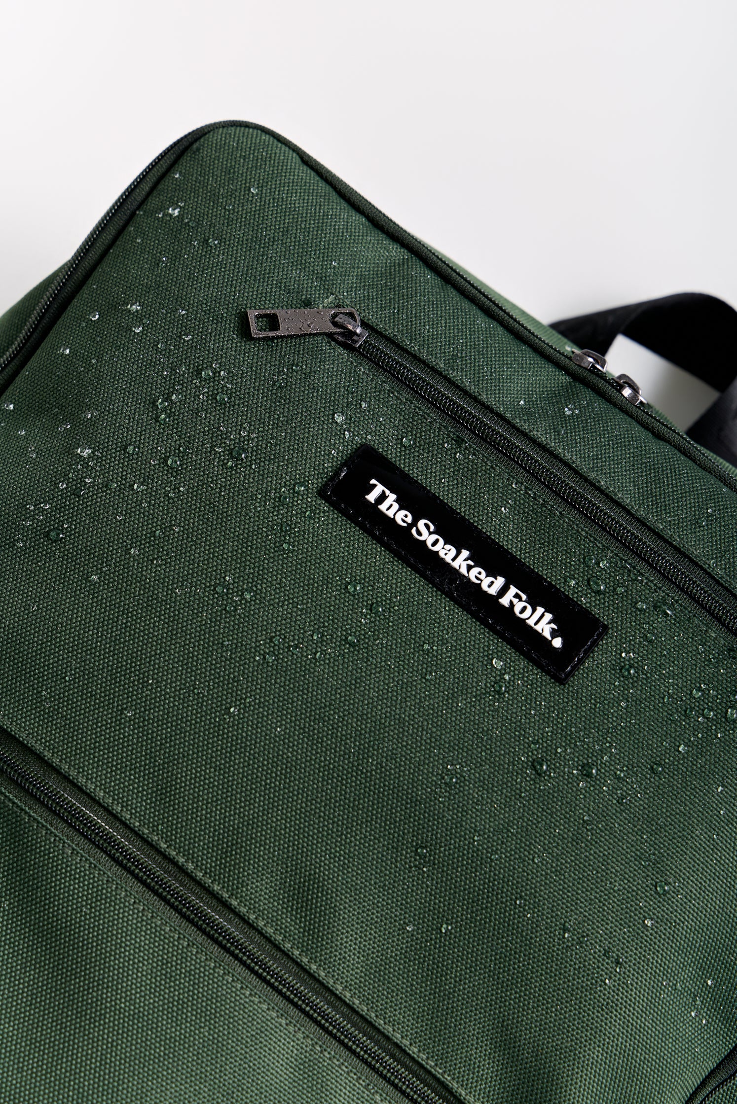 Green bag with 'The Soaked Folk' label on a white background